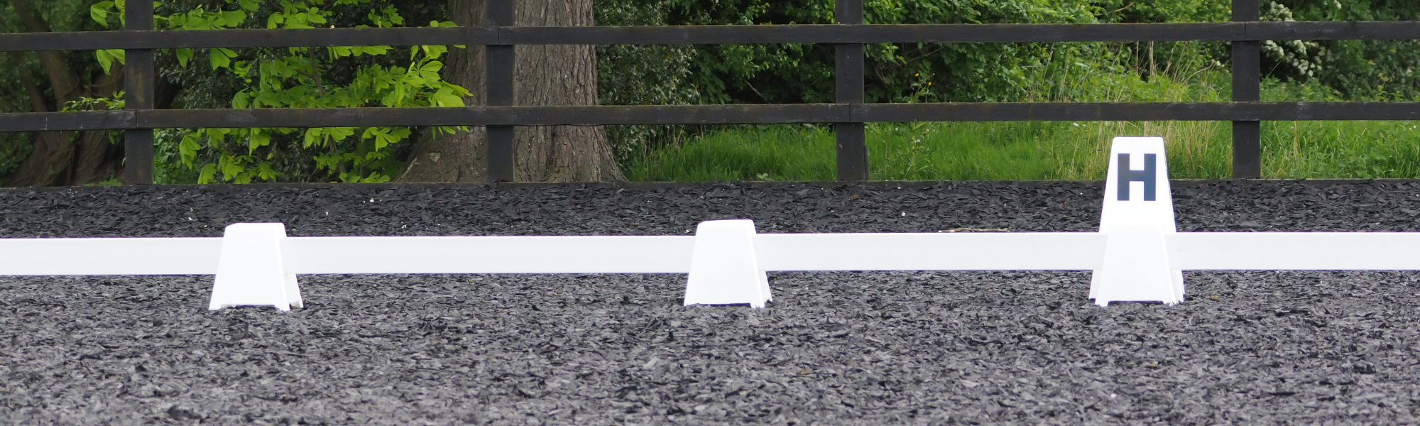 outdoor horse-riding arena with rubber footing mulch 